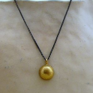 Dome 22k gold pendant on silver chain