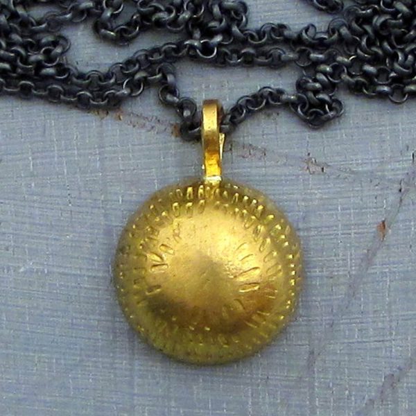 Dome 22k gold pendant on silver chain