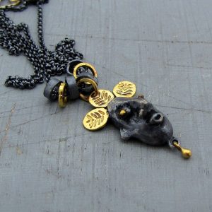 Artisan face 22 karat gold & silver necklace