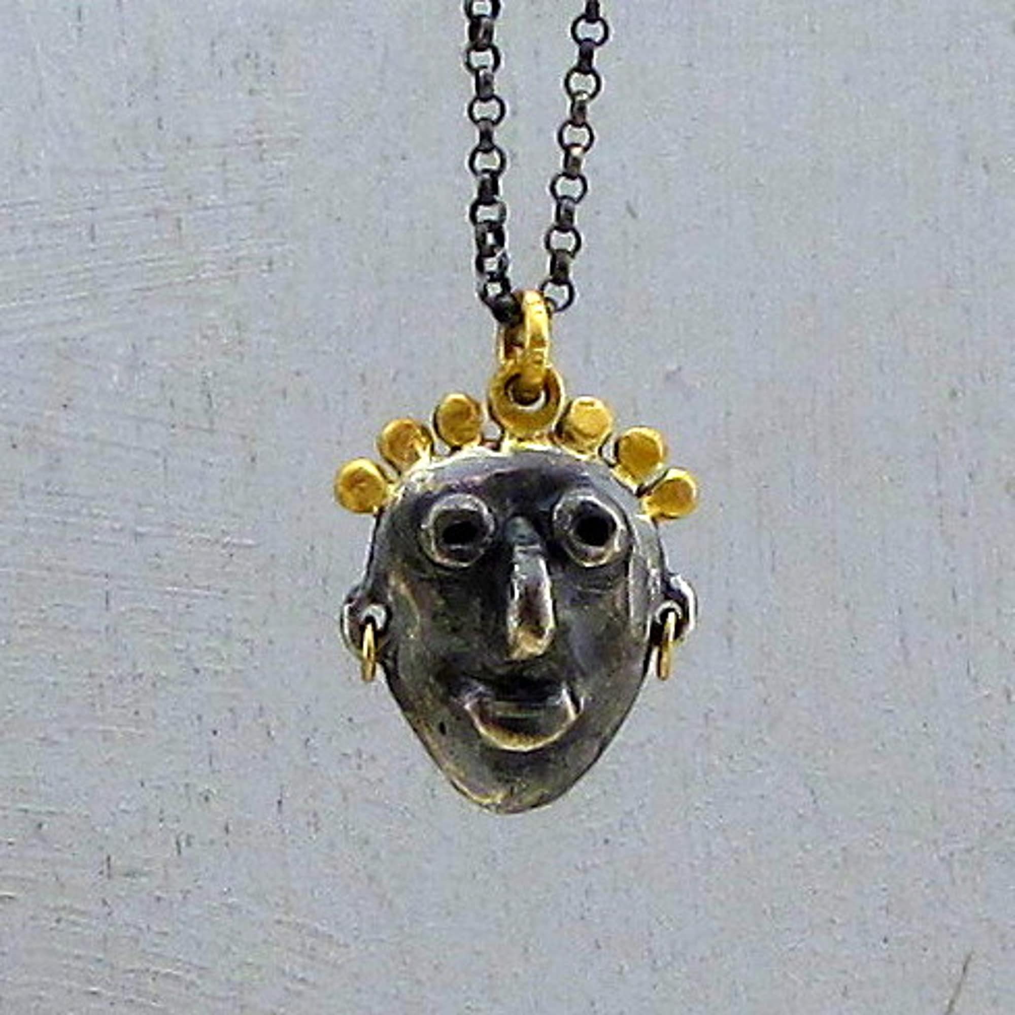 Artisan sculpted face 22k gold and silver pendant necklace