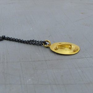 Face 22k gold & silver necklace