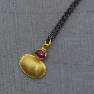 Ruby 24 karat gold pendant with silver necklace