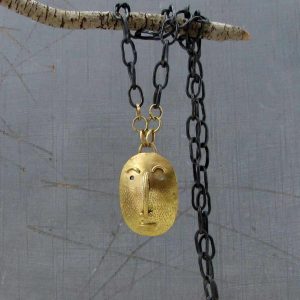 Handmade solid 14k gold Face pendant on a silver chain