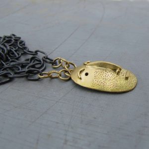 Handmade solid 14k gold Face pendant on a silver chain