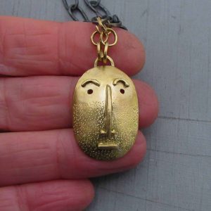 Handmade solid 14k gold Face pendant on a silver chain