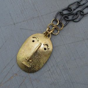 Handmade solid 14k gold Face pendant on a silver chain