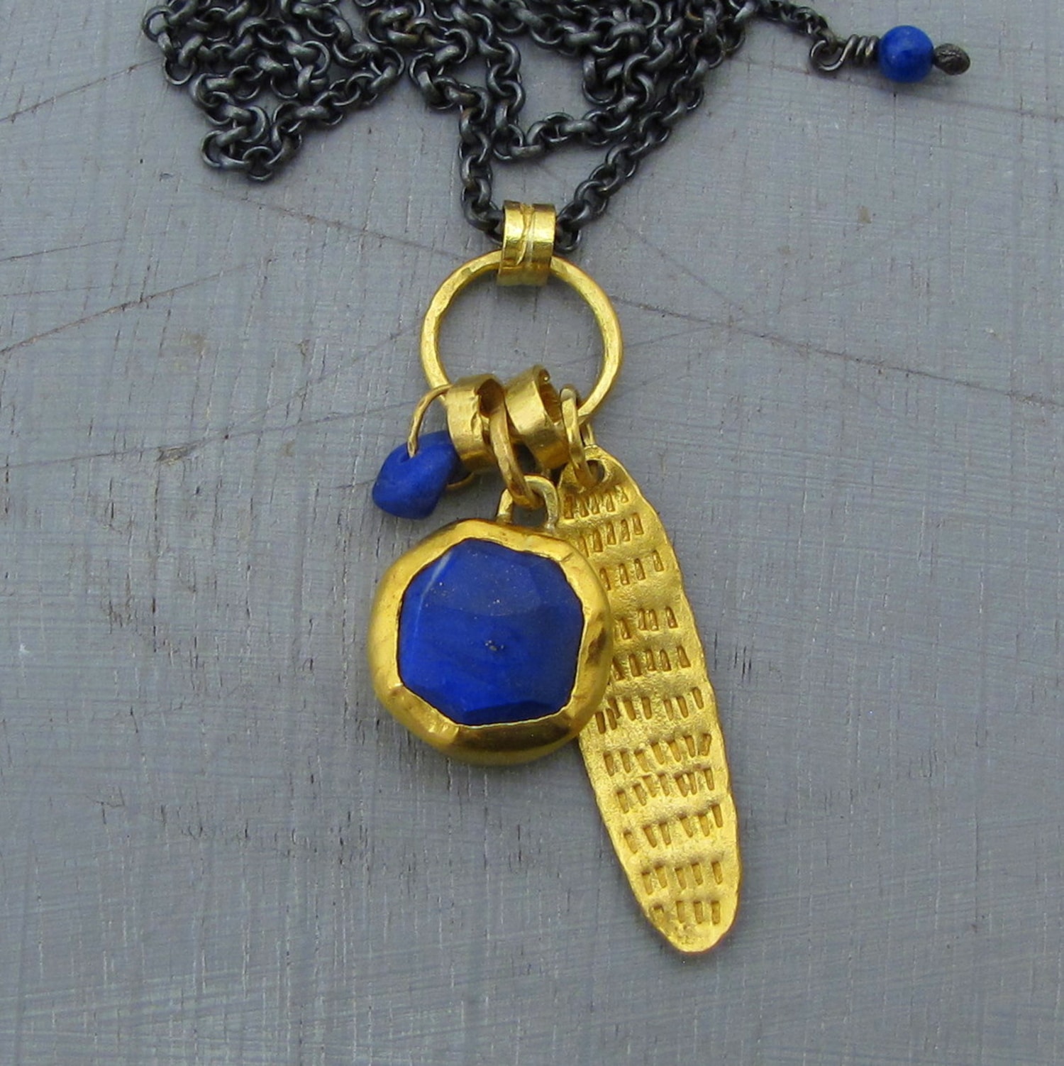 Lapis Lazuli 24k gold pendant on a silver chain