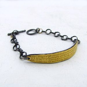 Textured 22k gold bar and silver bracelet