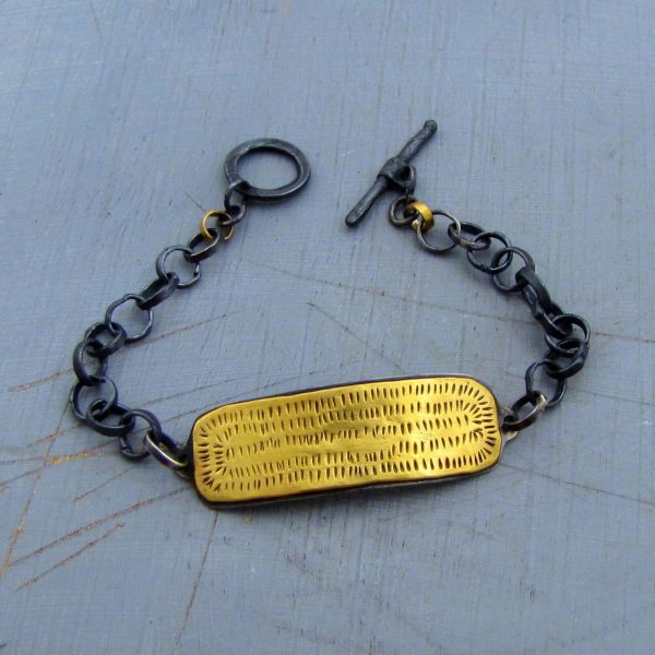 22k gold bar and silver bracelet