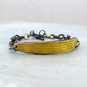 Textured 22k gold bar and silver bracelet