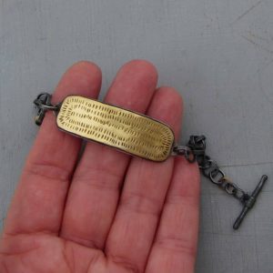 22k gold bar and silver bracelet