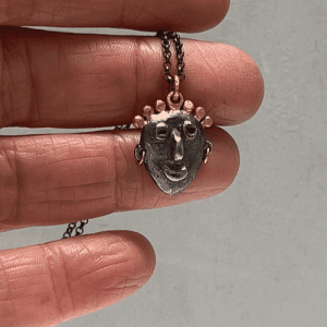 face 22k gold and silver pendant necklace