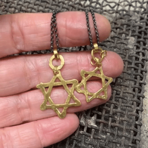 Star of David 22k gold pendant on silver chain