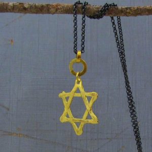 Star of David 22k gold pendant on silver chain