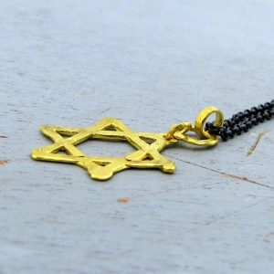 Star of David 22k gold pendant on silver chain