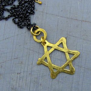 Star of David 22k gold pendant on silver chain