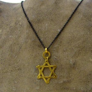 Star of David 22k gold pendant on silver chain