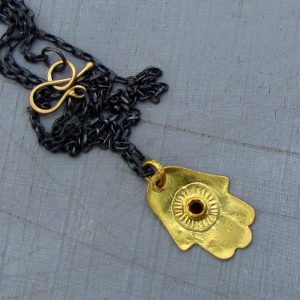 22k gold Hamsa and Garnet necklace