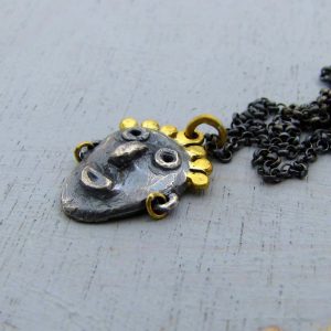 face 22k gold and silver pendant necklace