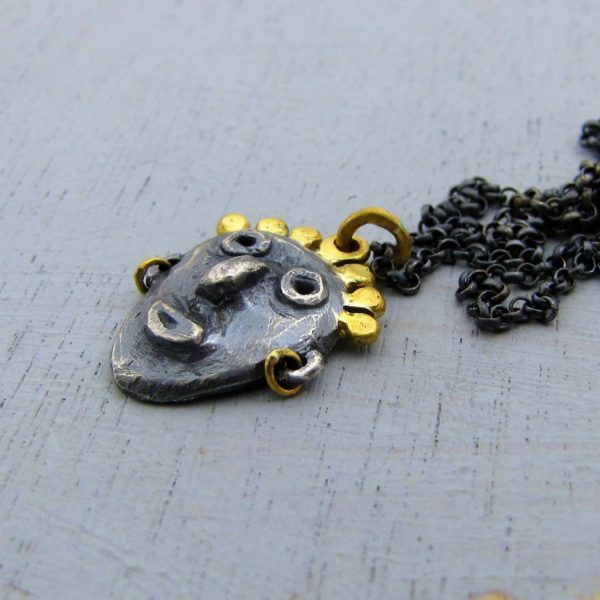 face 22k gold and silver pendant necklace