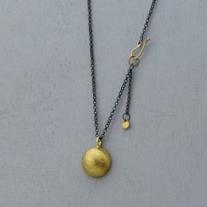 Dome 22k gold pendant on silver chain