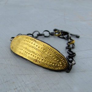 Textured 22k gold wide bar and silver bracelet