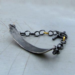 Textured 22k gold bar and silver bracelet