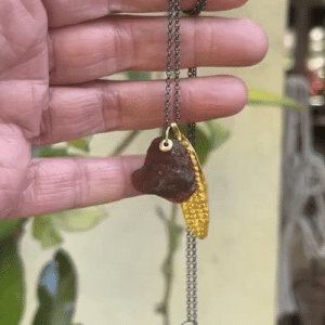 Rough Garnet 22k gold pendant on a silver chain