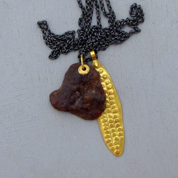 Rough Garnet 22k gold pendant on a silver chain