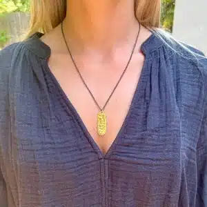 Rectangle 24k gold pendant on a silver chain