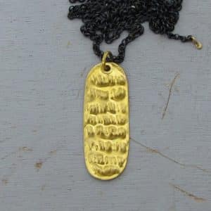 Rectangle 24k gold pendant on a silver chain