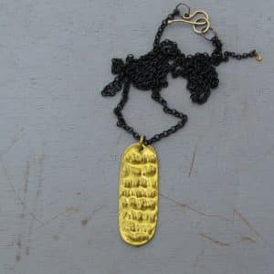 Rectangle 24k gold pendant on a silver chain