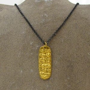 Rectangle 24k gold pendant on a silver chain